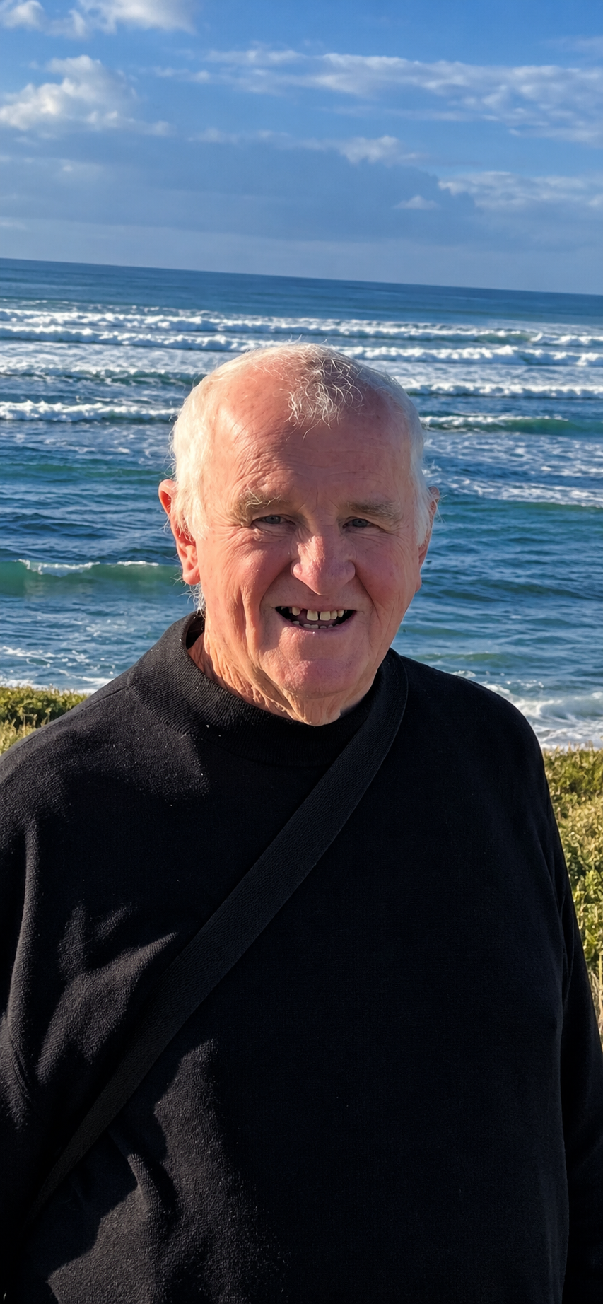 Smiling Elderly Man by the Ocean